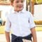 ECOFRIENDS garment 100% sustainable cotton. Long sleeved shirt for boy with belt loop and a button on the side to roll the sleeve up and adjust the length. Shirt collar. Button fastenings down the front. Functional front pocket. L/s shirt Outside 100% Cotton Washing instructions