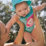 Newborn girl swimsuit with solar protective hat