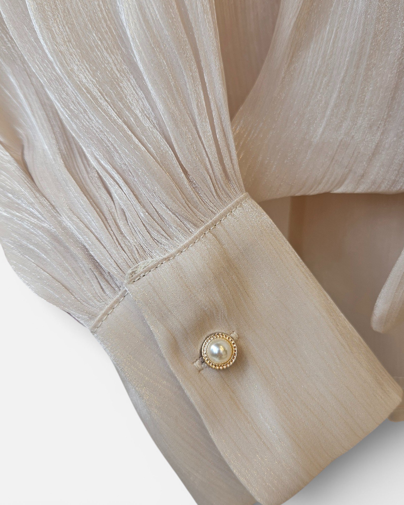 Shiny blouse with bow