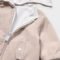 Reversible windbreaker for newborns