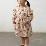 Printed dress with a baby bag