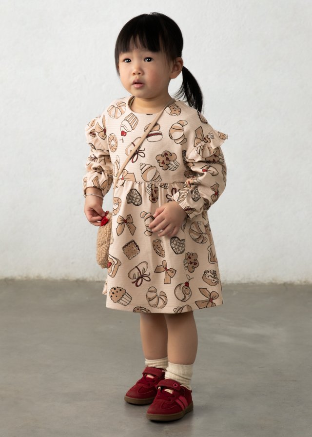 Printed dress with a baby bag